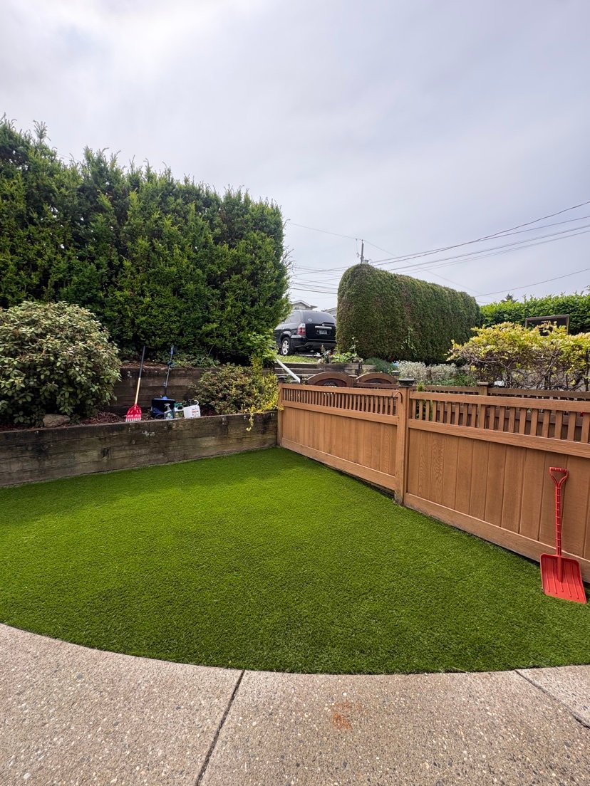 Fresh artificial turf lawn installed by Aura Maintenance Corp